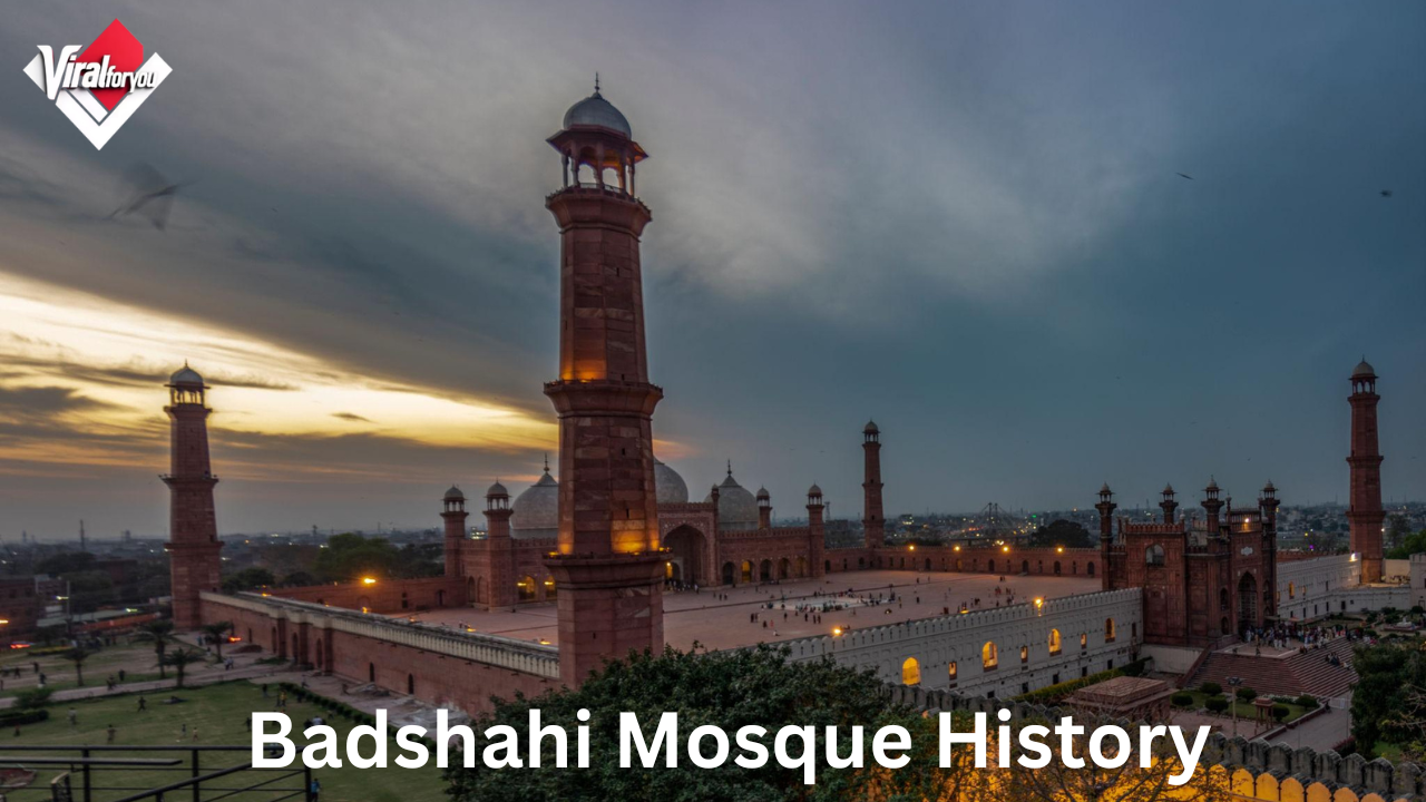 Badshahi Mosque in Lahore showcasing its grand Mughal architecture, red sandstone walls, white marble domes, and towering minarets against a clear sky.